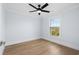 Bright bedroom with natural light, wood-look flooring and a ceiling fan at 2302 Seaseeker Ln., Myrtle Beach, SC 29577