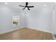 This bedroom is well-lit with a fan and a window with a view at 2302 Seaseeker Ln., Myrtle Beach, SC 29577