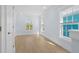 Bright bedroom with hardwood floors, two windows for ample natural light, and neutral paint at 2302 Seaseeker Ln., Myrtle Beach, SC 29577