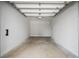 Spacious, empty garage with concrete flooring and white walls awaiting personalization for your vehicles and storage needs at 2302 Seaseeker Ln., Myrtle Beach, SC 29577