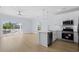 Inviting open-concept kitchen with stainless appliances, a breakfast bar, and light wood flooring at 2302 Seaseeker Ln., Myrtle Beach, SC 29577