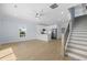 Open living room and modern kitchen with staircase and wood flooring at 2302 Seaseeker Ln., Myrtle Beach, SC 29577