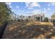 Spacious backyard view showcasing the home and neighboring properties at 301 Climbing Vine Ct., Conway, SC 29526
