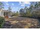 Large backyard with grassy area, providing ample space for outdoor activities at 301 Climbing Vine Ct., Conway, SC 29526