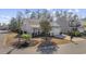 Gray house with white garage door and landscaping, viewed from the street at 301 Climbing Vine Ct., Conway, SC 29526