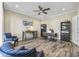 Bright home office features hardwood floors, built-in shelving, and comfortable seating at 301 Climbing Vine Ct., Conway, SC 29526