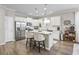 Modern kitchen with white cabinets, stainless steel appliances, and an island at 301 Climbing Vine Ct., Conway, SC 29526