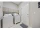 Laundry room with washer, dryer, and cabinets at 301 Climbing Vine Ct., Conway, SC 29526