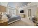 Spacious main bedroom with large bed, TV, and neutral decor at 301 Climbing Vine Ct., Conway, SC 29526