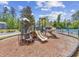Community playground with slides and climbing structures for children at 301 Climbing Vine Ct., Conway, SC 29526