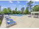 Community pool with plenty of lounge chairs and a pergola at 301 Climbing Vine Ct., Conway, SC 29526