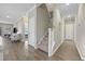 Modern staircase with carpeted steps and hardwood floors at 301 Climbing Vine Ct., Conway, SC 29526