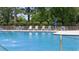 Inviting community swimming pool with lounge chairs for relaxation at 301 Climbing Vine Ct., Conway, SC 29526