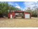 Red barn with large garage doors and storage at 3480 Highway 348, Loris, SC 29569