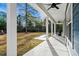 Porch with rocking chair overlooking backyard at 3480 Highway 348, Loris, SC 29569