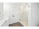Bright bathroom featuring a glass-enclosed shower, white shiplap walls and modern fixtures at 356 Rossdhu Ave., Pawleys Island, SC 29585