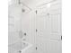 Clean bathroom featuring a shower over tub with glass enclosure and white subway tile at 356 Rossdhu Ave., Pawleys Island, SC 29585