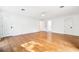 Spacious bedroom with light hardwood floors, white walls and ceiling, and two entry doors at 356 Rossdhu Ave., Pawleys Island, SC 29585
