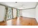 Bright bedroom with hardwood floors and large windows with decorative curtains at 356 Rossdhu Ave., Pawleys Island, SC 29585