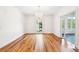 Formal dining room with hardwood floors, a chandelier, and ample natural light at 356 Rossdhu Ave., Pawleys Island, SC 29585
