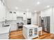 Gourmet kitchen with custom cabinets, stainless steel appliances, and a center island at 356 Rossdhu Ave., Pawleys Island, SC 29585