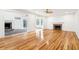 Spacious living room featuring hardwood floors, a ceiling fan, and a fireplace at 356 Rossdhu Ave., Pawleys Island, SC 29585