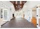 Sunroom boasting brick floors, a fireplace, a wood ceiling, and lots of natural light at 356 Rossdhu Ave., Pawleys Island, SC 29585
