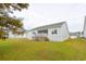 Back of house showing deck, screened porch and yard at 417 Grain Field Dr., Georgetown, SC 29440