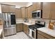 Modern kitchen with stainless steel appliances and light brown cabinets at 417 Grain Field Dr., Georgetown, SC 29440