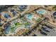 Aerial view of community pools, lazy river, palm trees, and parking at 4463 Livorn Loop # 4463, Myrtle Beach, SC 29579