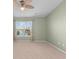 Bright bedroom with a ceiling fan, neutral carpet, and a window offering serene outdoor views at 4463 Livorn Loop # 4463, Myrtle Beach, SC 29579