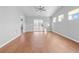 Light filled living room featuring wood floors, neutral walls, sliding glass doors, and great natural light at 4463 Livorn Loop # 4463, Myrtle Beach, SC 29579