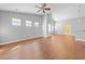 Bright open living space with light gray walls, wood floors, a ceiling fan, and great natural light at 4463 Livorn Loop # 4463, Myrtle Beach, SC 29579