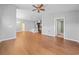 Open-concept living space with hardwood floors connecting to a modern kitchen at 4463 Livorn Loop # 4463, Myrtle Beach, SC 29579