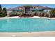 Resort style pool with palm trees and covered seating at 4463 Livorn Loop # 4463, Myrtle Beach, SC 29579
