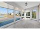 Enclosed sunroom with tile flooring and several windows providing panoramic views of the backyard at 4463 Livorn Loop # 4463, Myrtle Beach, SC 29579