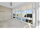 Enclosed sunroom with tile flooring and several windows providing panoramic views of the outdoors at 4463 Livorn Loop # 4463, Myrtle Beach, SC 29579