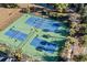 Aerial view of green and blue community tennis courts with lighting at 4463 Livorn Loop # 4463, Myrtle Beach, SC 29579