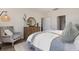 Bright bedroom featuring wood floors, stylish decor, and a comfortable armchair at 544 Duvall St., Longs, SC 29568