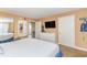 Spacious bedroom featuring a dresser, TV, and comfortable bed at 6804 N Ocean Blvd. # 1009, Myrtle Beach, SC 29572