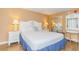 Bright bedroom with a comfortable queen bed and stylish nightstands at 6804 N Ocean Blvd. # 1009, Myrtle Beach, SC 29572