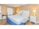 Cozy bedroom with a queen bed, nightstands, and access to a balcony at 6804 N Ocean Blvd. # 1009, Myrtle Beach, SC 29572