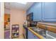 Kitchen with blue cabinets, black appliances, and granite countertop at 6804 N Ocean Blvd. # 1009, Myrtle Beach, SC 29572