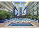 Inviting pool area with multiple lounge chairs and a hot tub at 6804 N Ocean Blvd. # 1009, Myrtle Beach, SC 29572