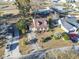 Aerial view of a charming home with a driveway, garage, and well-manicured landscaping in a Gathering-friendly neighborhood at 702 Plantation Dr., Surfside Beach, SC 29575
