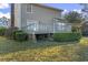 Back deck with brick supports and green shrubs, offering a relaxing outdoor space with access to the yard at 702 Plantation Dr., Surfside Beach, SC 29575