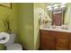 Well-maintained bathroom with a single vanity, decorative accents, and a clean, functional layout at 702 Plantation Dr., Surfside Beach, SC 29575