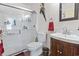 Well-lit bathroom features a glass-enclosed shower, vanity, and neutral decor at 702 Plantation Dr., Surfside Beach, SC 29575