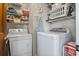 Functional laundry room featuring modern appliances and ample shelving for organized storage solutions at 702 Plantation Dr., Surfside Beach, SC 29575