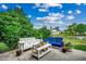 Landscaped backyard featuring bench seating, a view of the pond, and mature shrubs for added privacy at 8605 Hopper Ct., Myrtle Beach, SC 29579